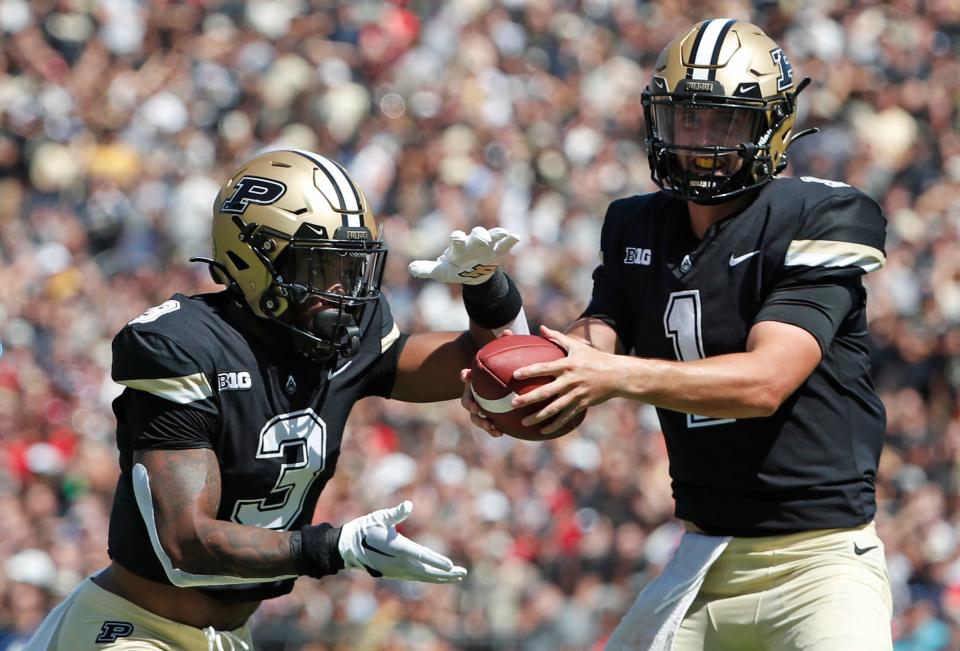 Purdue Boilermakers running back Tyrone Tracy Jr. (3) receives a hand-off from Purdue Boilermakers quarterback Hudson Card (1) during the NCAA football game against the Fresno State Bulldogs, Saturday, Sept. 2, 2023, at Ross-Ade Stadium in West Lafayette, Ind. Fresno State Bulldogs won 39-35.