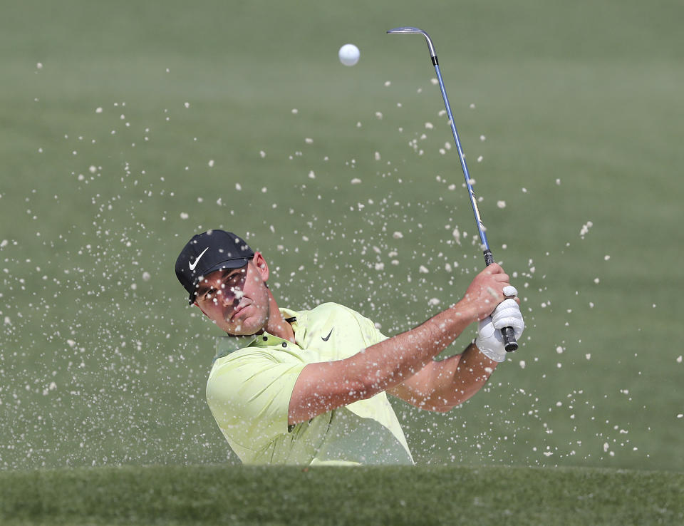 Brooks Koepka hits his bunker shot to the second green during his practice round for the Masters at Augusta National Golf Club on Tuesday, April 6, 2021, in Augusta, Ga. (Curtis Compton/Atlanta Journal-Constitution via AP)