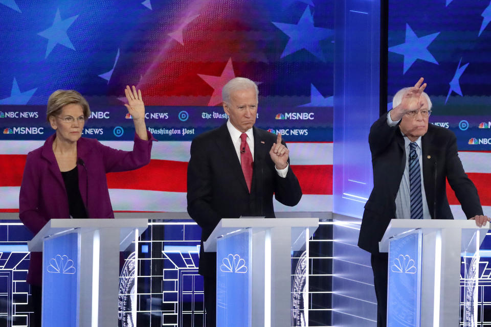 Democratic presidential candidates Elizabeth Warren, Joe Biden and Bernie Sanders participate in the November primary debate in Atlanta. (Photo: Alex Wong via Getty Images)