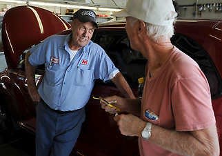 Richard “Newt” Chitwood, 74, left, talks with longtime customer and friend Blaine Allen, 69, right, about Chitwood’s decision to retire.Chris Howell | Herald-Times