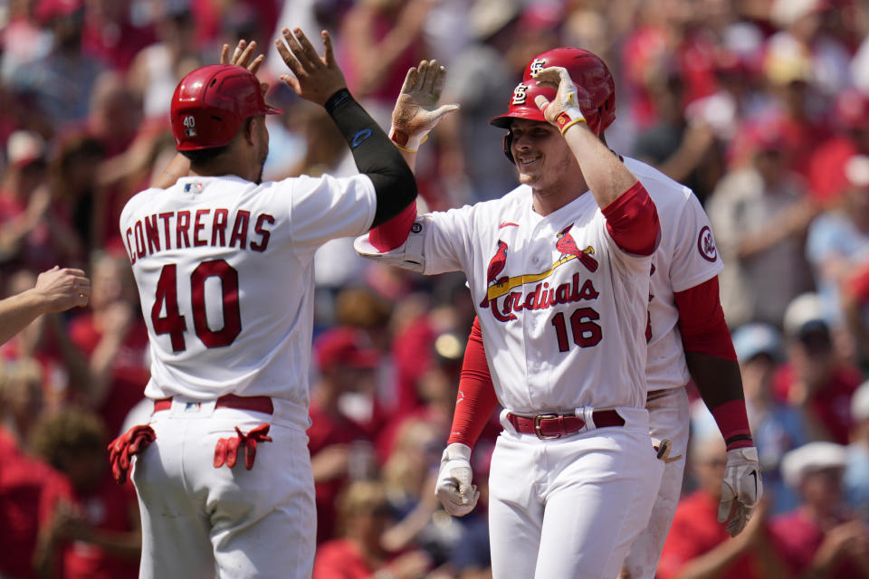 St. Louis Cardinals' Nolan Gorman (16) is congratulated by teammate Willson Contreras (40) after hitting a grand slam during the sixth inning of a baseball game against the Arizona Diamondbacks Wednesday, April 19, 2023, in St. Louis. (AP Photo/Jeff Roberson)