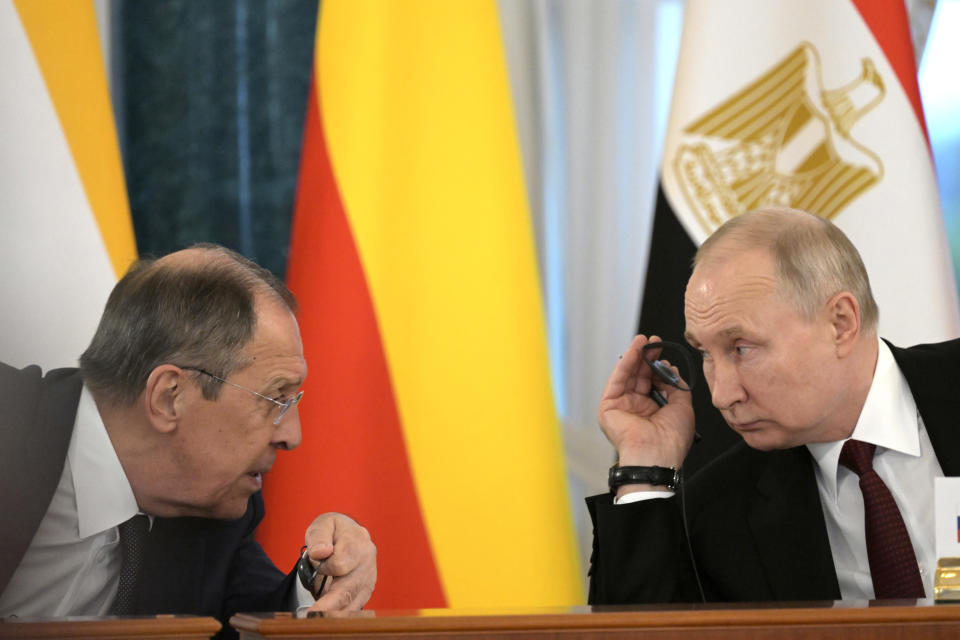 In this handout photo provided by Photo host Agency RIA Novosti, Russian President Vladimir Putin, right, and Russian Foreign Minister Sergey Lavrov talk during a meeting with a delegation of African leaders and senior officials in St. Petersburg, Russia, Saturday, June 17, 2023. Seven African leaders — presidents of Comoros, Senegal, South Africa and Zambia, as well as Egypt's prime minister and top envoys from the Republic of Congo and Uganda — traveled to Russia on Saturday a day after visiting Ukraine on a mission to try to help end the hostilities. (Evgeny Biyatov/Photo host Agency RIA Novosti via AP)