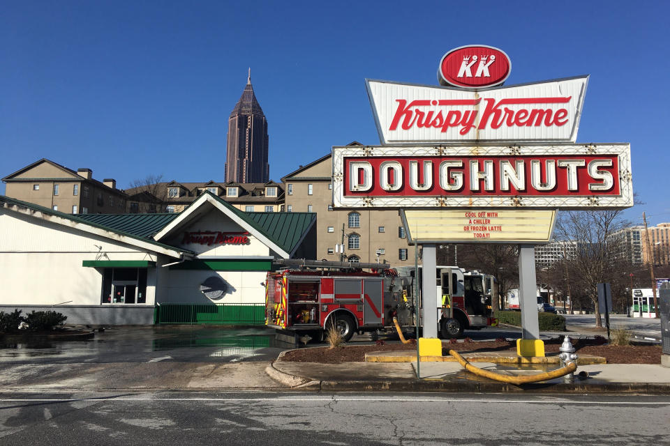 Firefighters work at the Krispy Kreme Doughnuts store owned by Shaquille O'Neal in Atlanta 