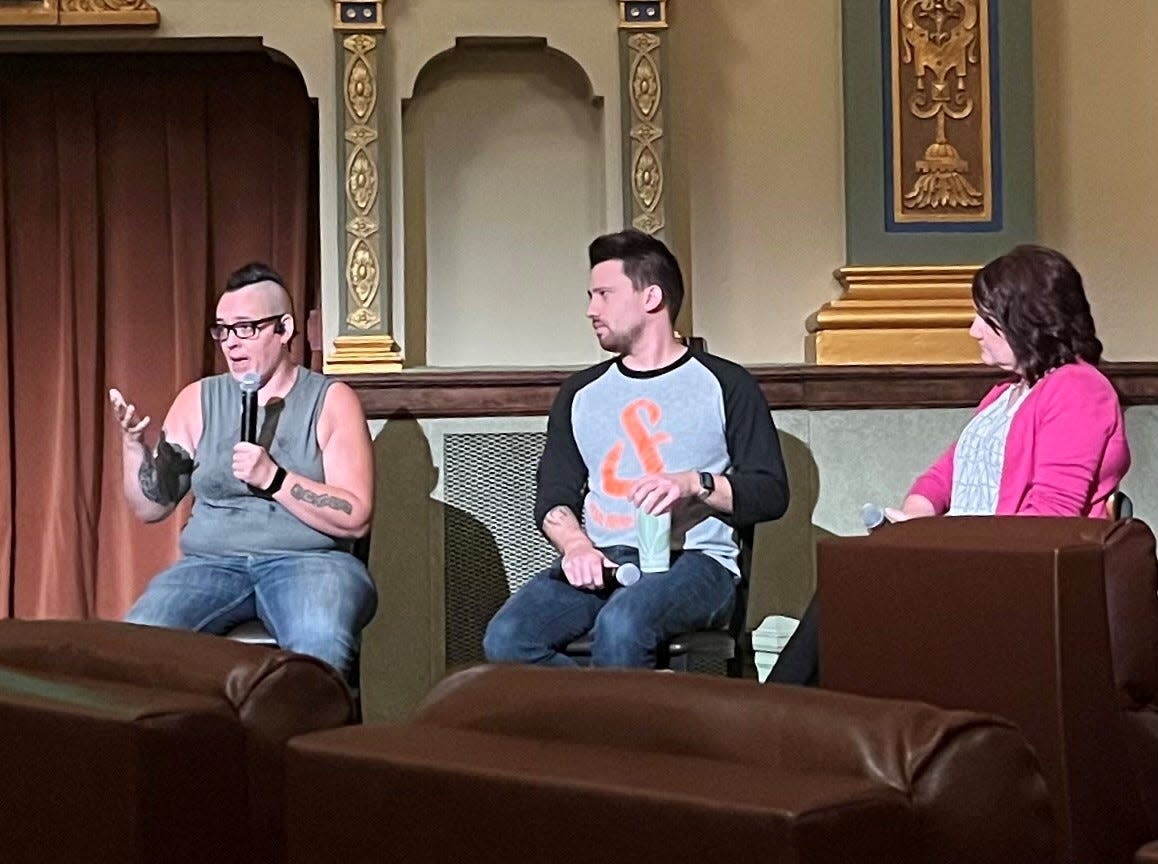 Boots Among Trees (left) speaks on their traumatizing experience undergoing conversion therapy at a young age at the State Theatre on Sept. 13, 2022. Boots is joined by Cody Ingle (center) and Susan Williams (right).