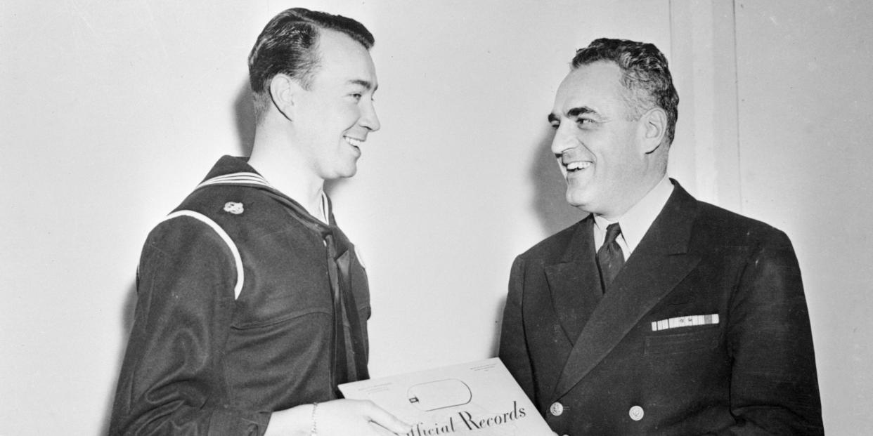 William Patrick Hitler, 34-year-old nephew of the late unlamented Nazi dictator, is shown (left), as he received his discharge from the U. S. Navy in the Fargo building Separation Center at Boston.