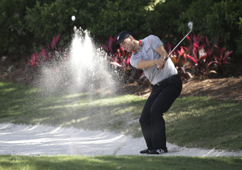 Martin Kaymer of Germany, hits from a sand trap on the 14th fairway during the second round of The Players championship golf tournament at TPC Sawgrass, Friday, May 9, 2014, in Ponte Vedra Beach, Fla. (AP Photo/John Raoux)