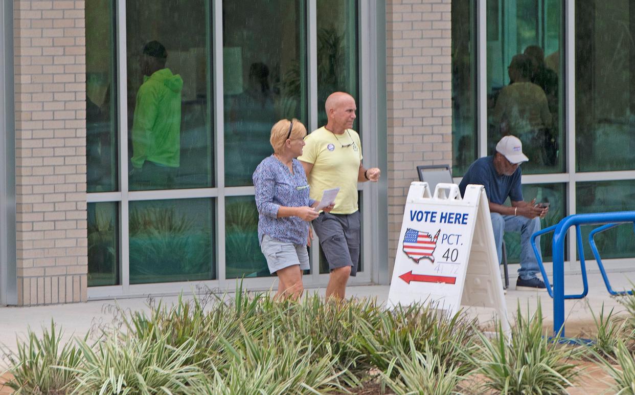 Voters arrive at the Bayview Community Center on Aug. 23 to cast their ballots in the primary election.