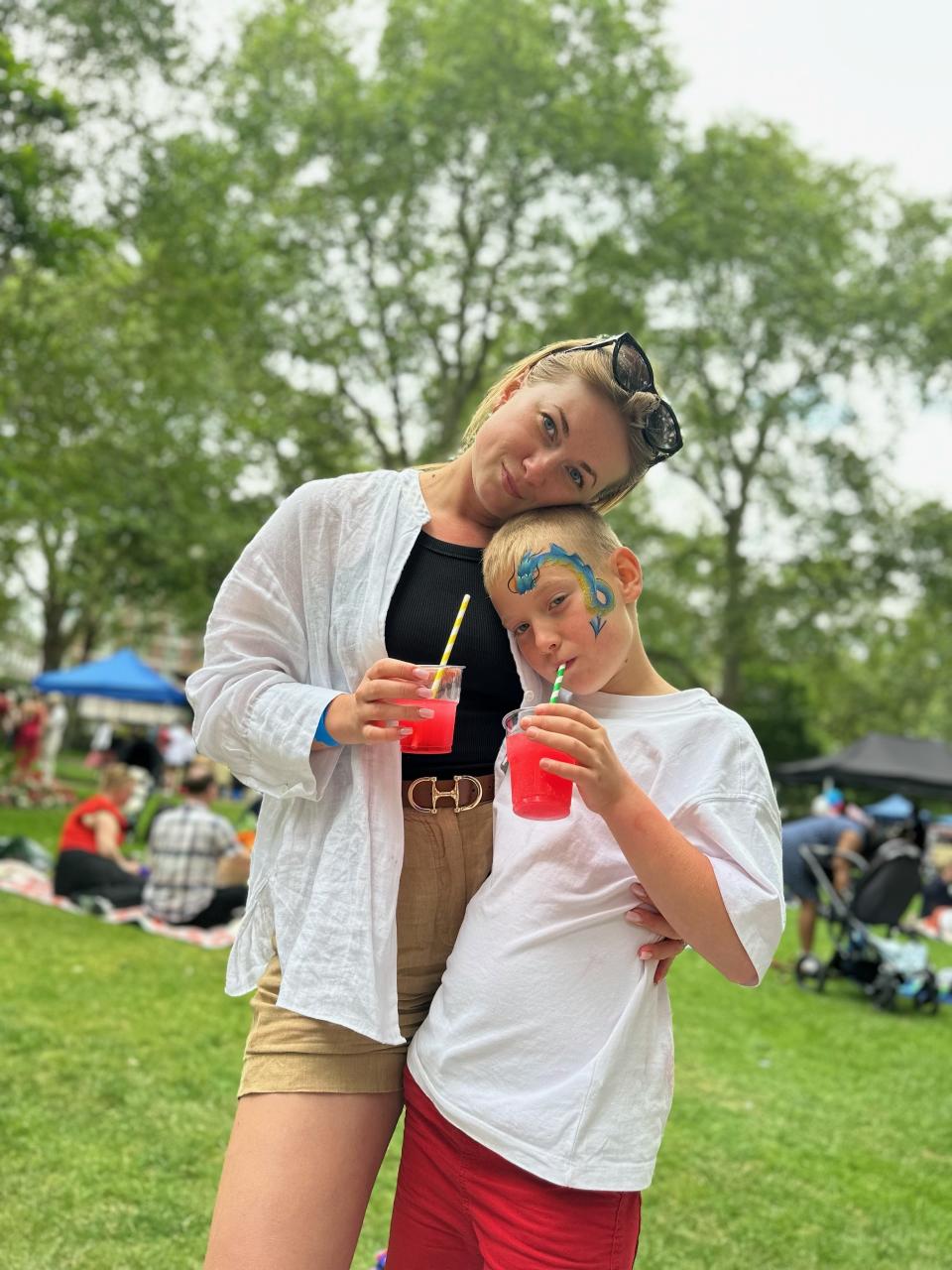 Woman and boy posing together 