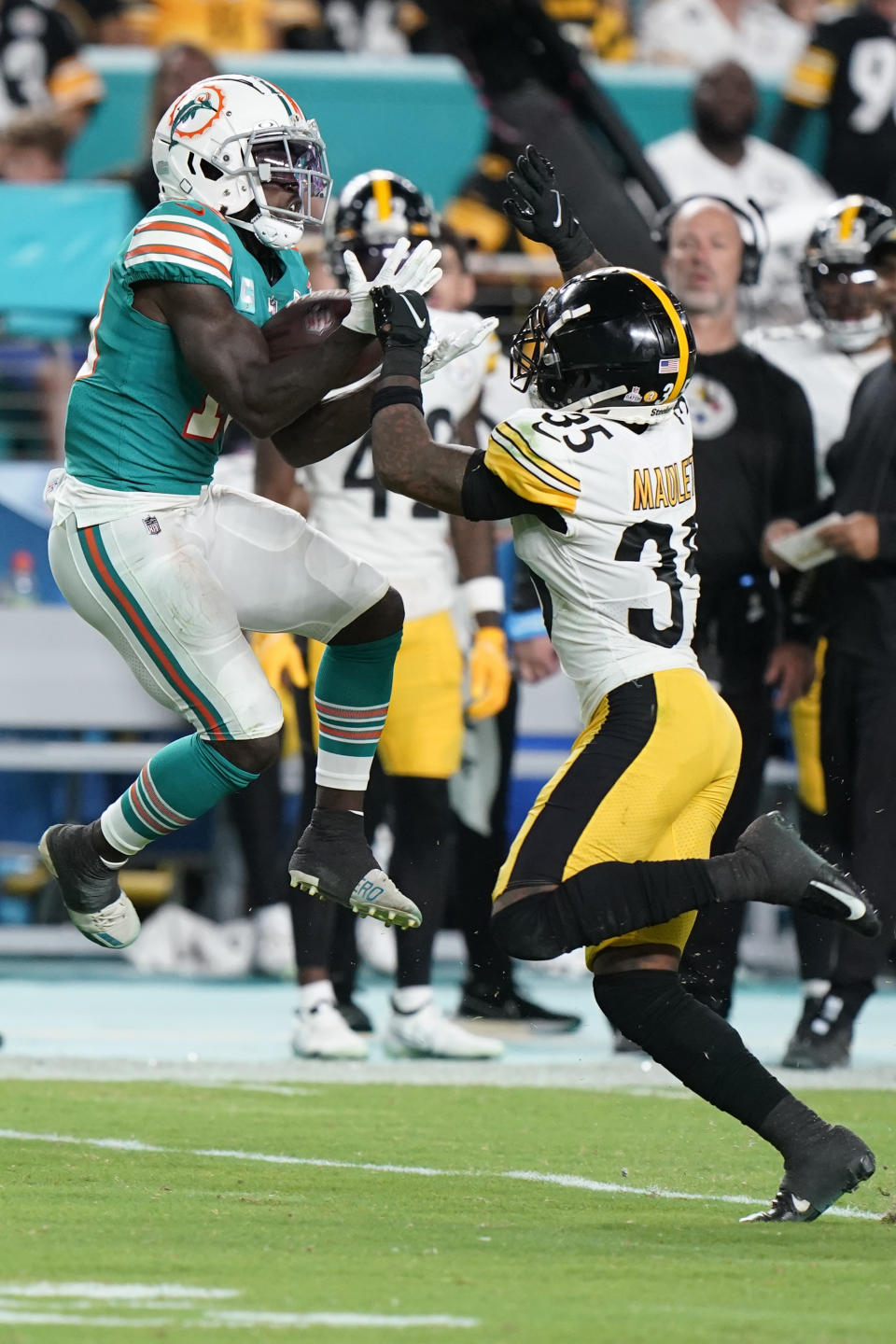 Miami Dolphins wide receiver Tyreek Hill (10) grabs a pass as Pittsburgh Steelers cornerback Arthur Maulet (35) defends during the first half of an NFL football game, Sunday, Oct. 23, 2022, in Miami Gardens, Fla. (AP Photo/Wilfredo Lee )