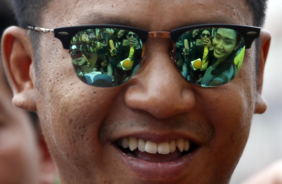 In this Wednesday, May 22, 2019, file photo, activist Jatupat Boonpattararaksa talks to reporters outside the Pathumwan police station in Bangkok, Thailand. Thirteen Thai political activists have appeared at a Bangkok police station to answer a summons on sedition charges that critics say are part of a plan to remove a rising progressive politician from the political scene. (AP Photo/Sakchai Lalit, File)