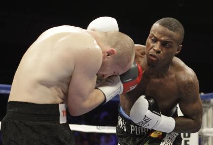 Peter Quillin (R) punches Lukas Konecny during their WBO Middleweight World Champion boxing match last April. (AP)