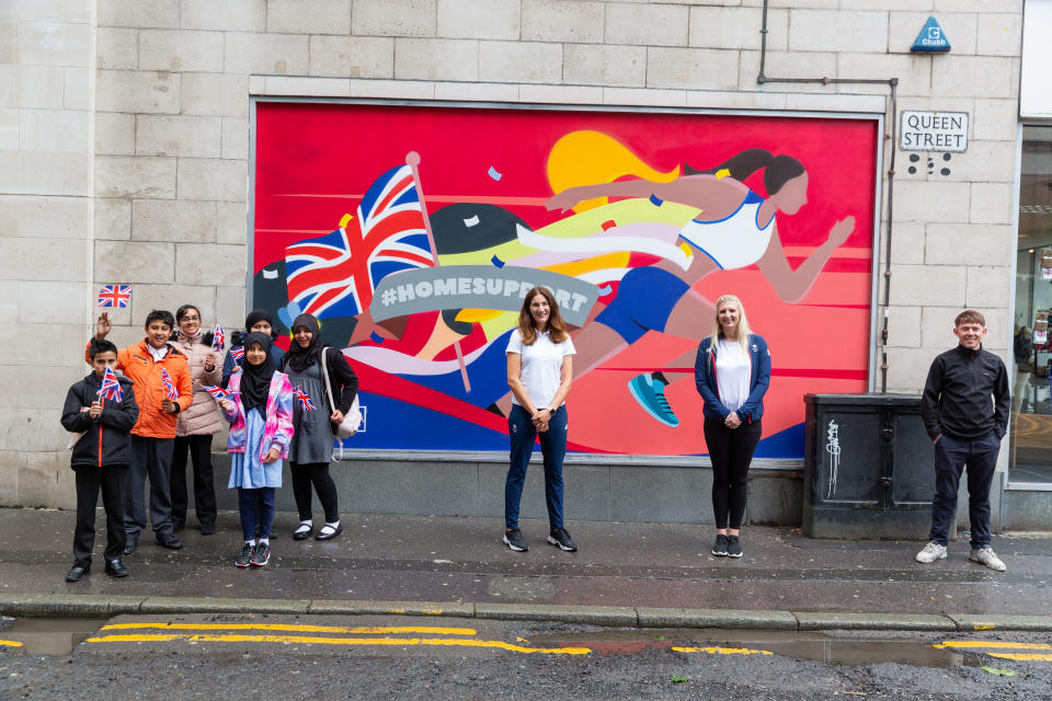 Local school children, Sarah Stevenson, Rebecca Adlington and artist Alex Altano at the unveiling of the mural in Manchester.