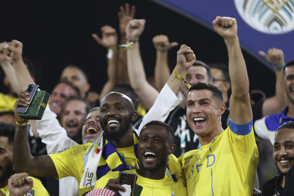 Al Nassr's Cristiano Ronaldo, celebrates after beating Al Hilal to win the Arab Club Championship Cup at King Fahd Stadium in Taif, Saudi Arabia, Saturday, Aug.12, 2023. (AP Photo/Samah Zidan)