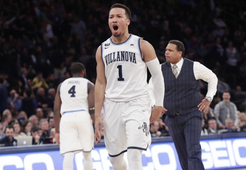 FILE - Providence coach Ed Cooley, right, and Villanova's Jalen Brunson (1) react after Brunson made a three point basket during the second half of an NCAA college basketball game in the Big East men's tournament finals Saturday, March 10, 2018, in New York. (AP Photo/Frank Franklin II, File)