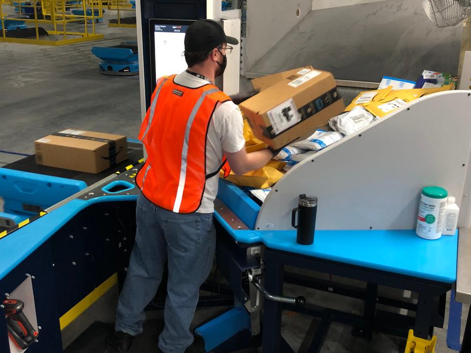 An employee sorts packages in October at the Amazon fulfillment center in Columbia County. Augusta-area job numbers are still below pre-pandemic levels in most labor sectors.
