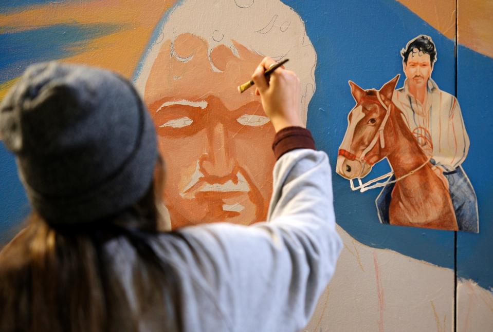 Nayelly Morales Rojo works on her mural for this year's Fresh Paint: OKC NYE Mural Project at the OKC Farmers Public Market Monday, November 7, 2022.