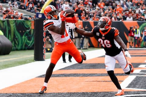 Cleveland Browns wide receiver Antonio Callaway (11) catches a touchdown pass against Cincinnati Bengals strong safety Shawn Williams (36) in the first half of an NFL football game - Credit: AP Photo/Gary Landers