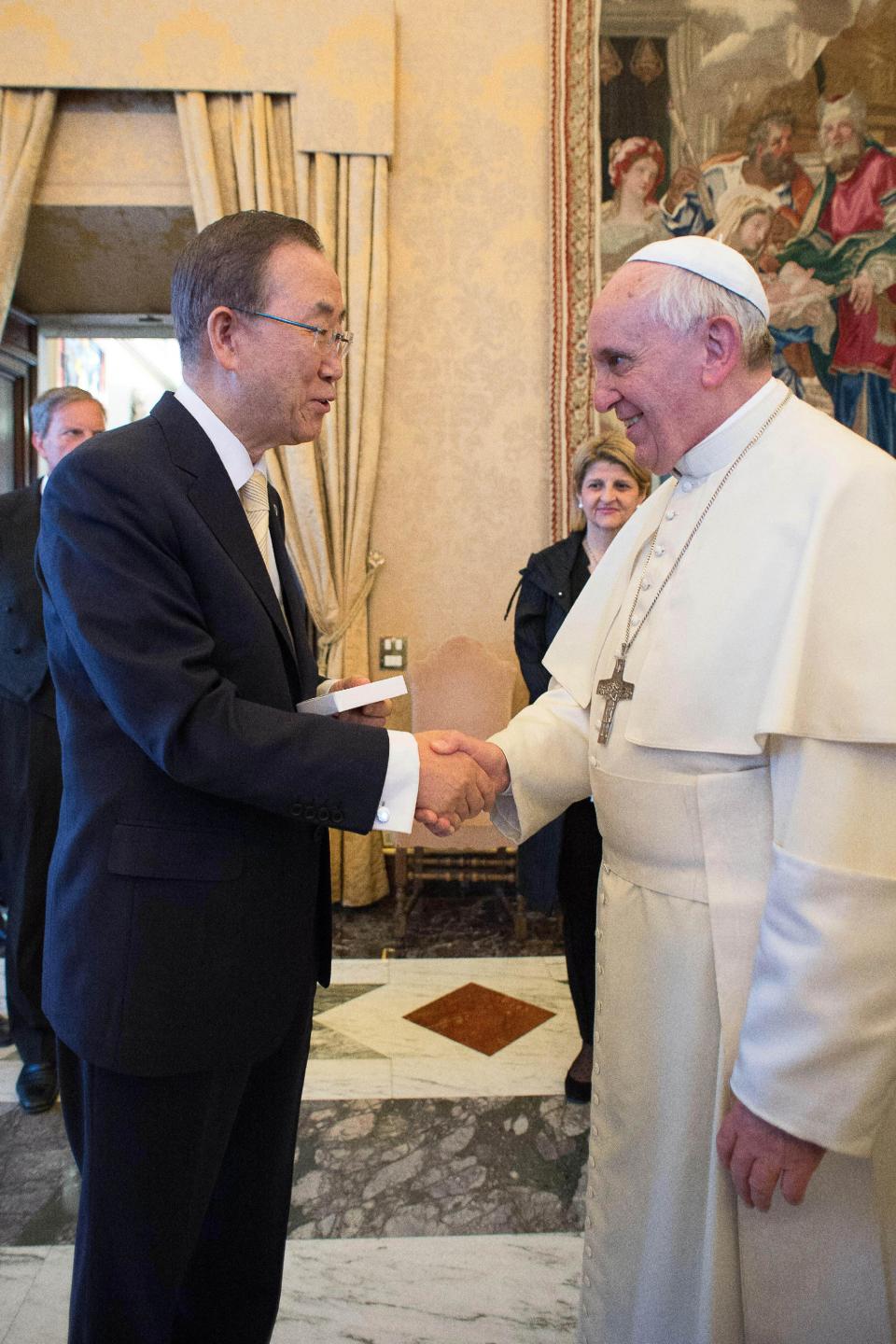 In this photo provided by the Vatican newspaper L'Osservatore Romano, Pope Francis greets U.N. Secretary-General Ban Ki-moon at the Vatican, Friday, May 9, 2014. Pope Francis called Friday for governments to redistribute wealth to the poor in a new spirit of generosity to help curb the "economy of exclusion" that is taking hold today. Francis made the appeal during a speech to U.N. Secretary-General Ban Ki-moon and the heads of major U.N. agencies who are meeting in Rome this week. Latin America's first pope has frequently lashed out at the injustices of capitalism and the global economic system that excludes so much of humanity. (AP Photo/L'Osservatore Romano)