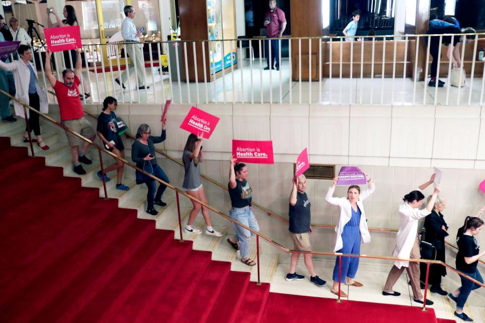Abortion rights protesters are removed after becoming vocal, Tuesday, May 16, 2023, in Raleigh, N.C., after North Carolina House members voted to override Democratic Gov. Roy Cooper's veto of a bill that would change the state's ban on nearly all abortions from those after 20 weeks of pregnancy to those after 12 weeks of pregnancy.