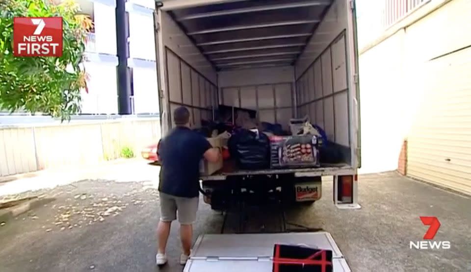 Removalists empty the unit Mrs Khodraga lived in for 18 years. Source: 7 News