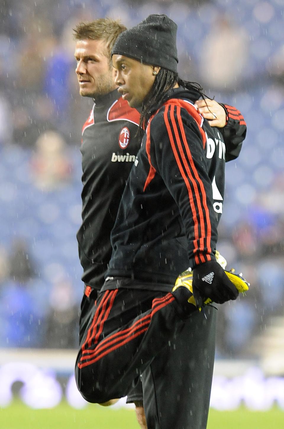 AC Milan's David Beckham (l) and Gaucho Ronaldinho warm up before the game at Ibrox