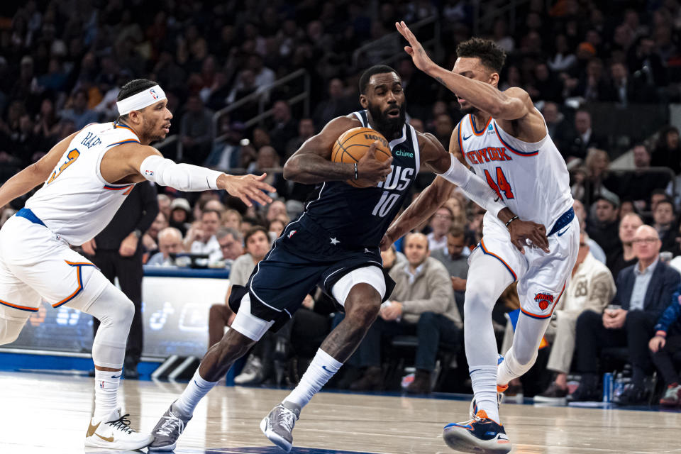 Dallas Mavericks forward Tim Hardaway Jr. (10) drives to the basket against New York Knicks guards Josh Hart (3) and Charlie Brown Jr. (44) during the first half of an NBA basketball game in New York, Thursday, Feb. 8, 2024. (AP Photo/Peter K. Afriyie)