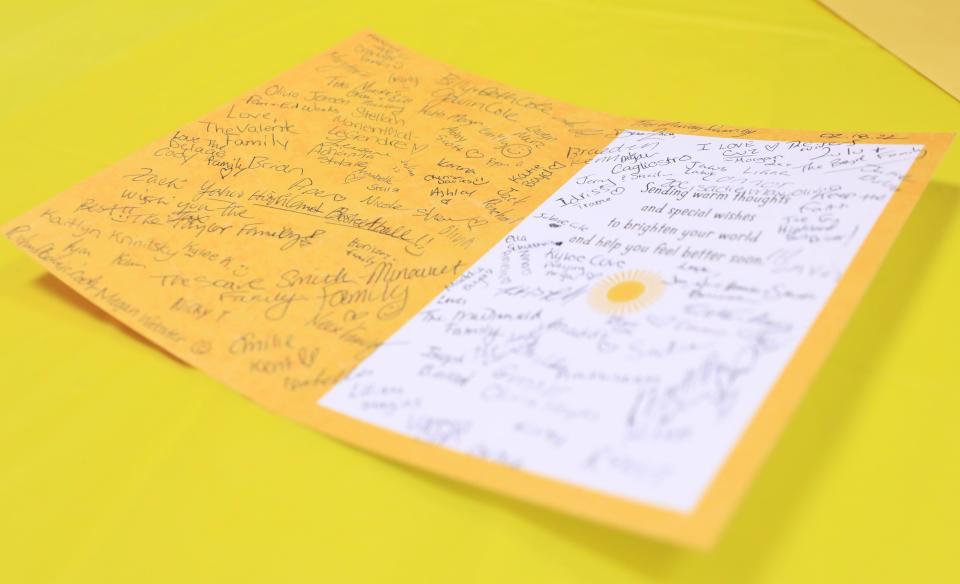 A card for Highland's Zach Osterhoudt was signed by many of the spectators before Friday's boys basketball game between Highland and Red Hook on Friday.