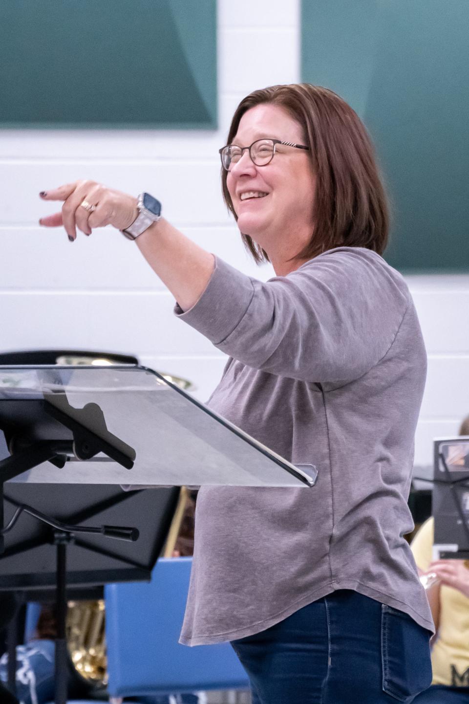 Cambridge music educator Michele Haverfield works with seventh grade students at the middle school. Haverfield will march in the Macy's Thanksgiving Day Parade, along with 400 other band directors from across the country.