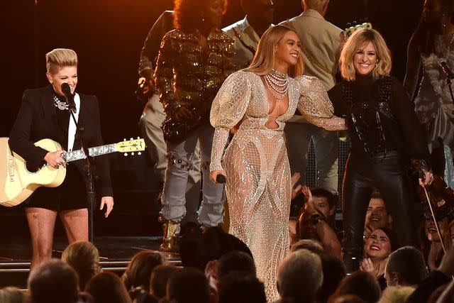 <p>Rick Diamond/Getty</p> Beyoncé and the Chicks at the 2016 CMA Awards