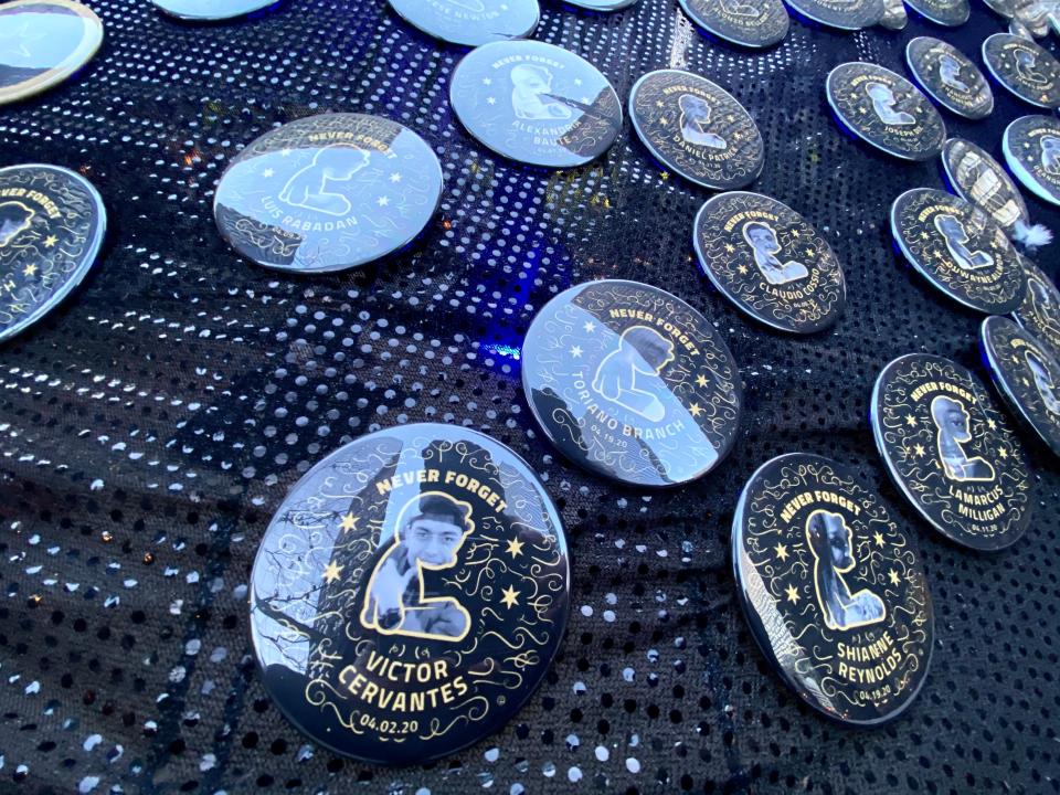 Ornaments bearing the names and images of Chicagoans killed in gun violence hang on the Tree of Remembrance at Daley Plaza in Chicago on Dec. 14, 2020.