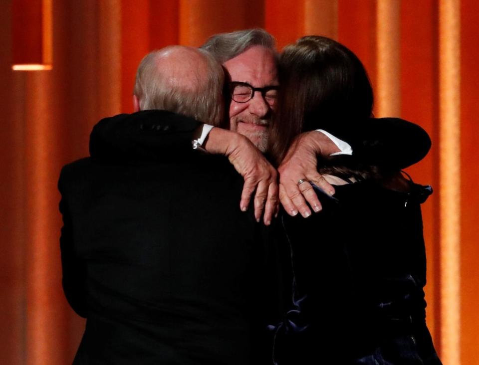 Steven Spielberg hugs Frank Marshal and Kathleen Kennedy. (Reuters)