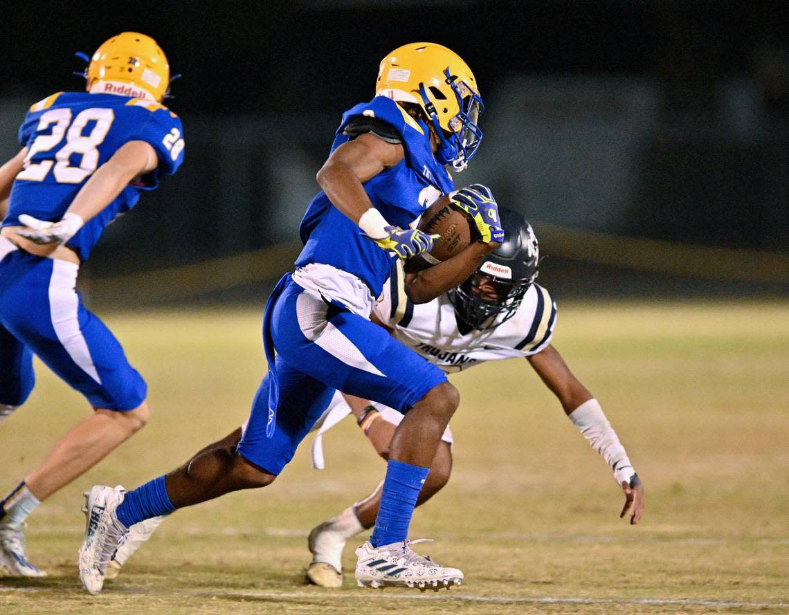 Tattnall Trojan Antone Johnson turns the corner and heads for the endzone against John Milledge Academy Friday night.