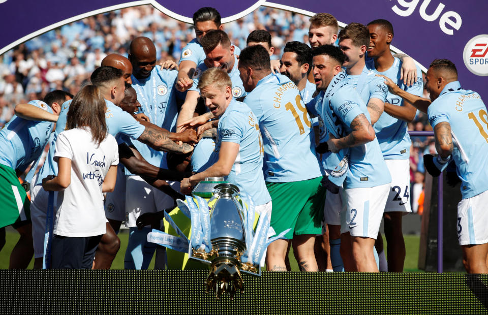 <p>Soccer Football – Premier League – Manchester City vs Huddersfield Town – Etihad Stadium, Manchester, Britain – May 6, 2018 The trophy falls as Manchester City celebrate after winning the Premier League title Action Images via Reuters/Carl Recine EDITORIAL USE ONLY. No use with unauthorized audio, video, data, fixture lists, club/league logos or “live” services. Online in-match use limited to 75 images, no video emulation. No use in betting, games or single club/league/player publications. Please contact your account representative for further details. </p>