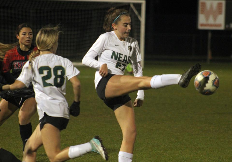 Nease midfielder Piper Crecco (27) controls a high ball during a Jan. 17 game against Creekside.