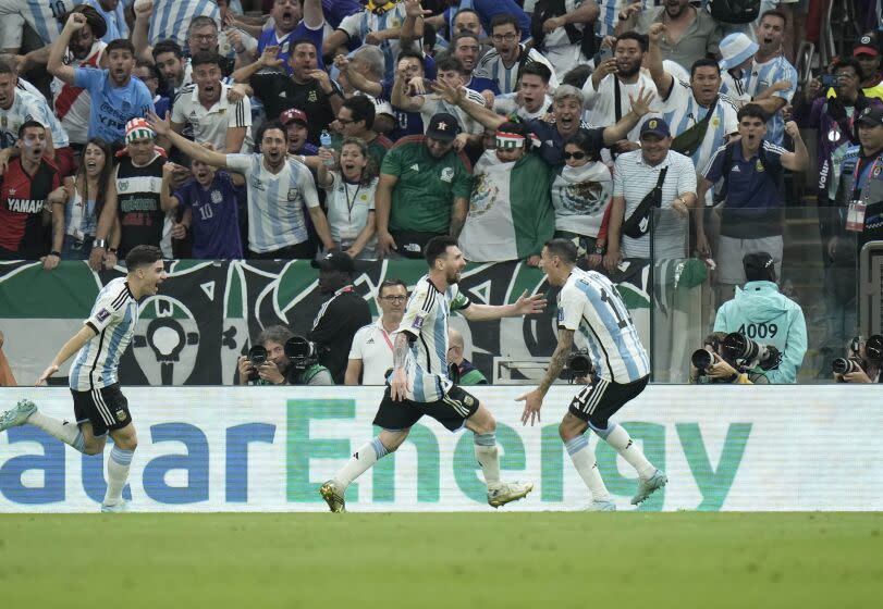 Argentina's Lionel Messi celebrates after scoring the first goal during the World Cup group C soccer match between Argentina and Mexico, at the Lusail Stadium in Lusail, Qatar, Saturday, Nov. 26, 2022. (AP Photo/Hassan Ammar)