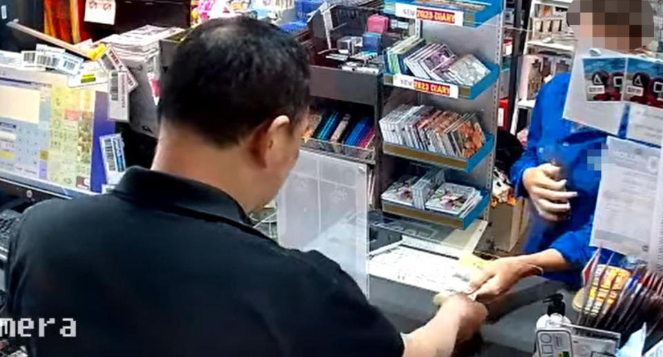 CCTV footage from Double Bay Newsagency boy handing over money