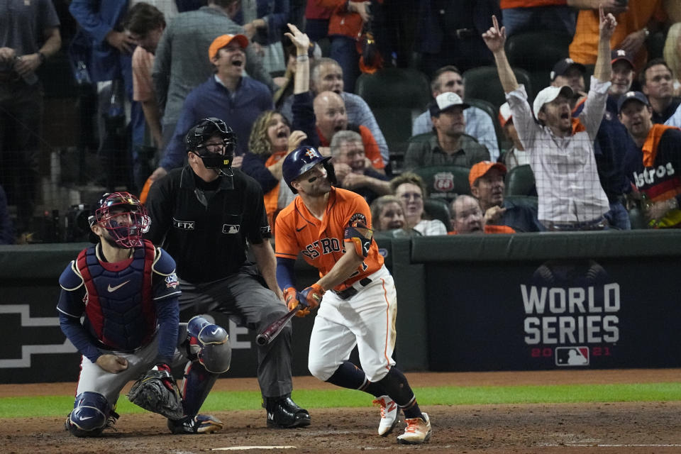 Houston Astros' Jose Altuve watches his home run during the seventh inning in Game 2 of baseball's World Series between the Houston Astros and the Atlanta Braves Wednesday, Oct. 27, 2021, in Houston. (AP Photo/Sue Ogrocki)