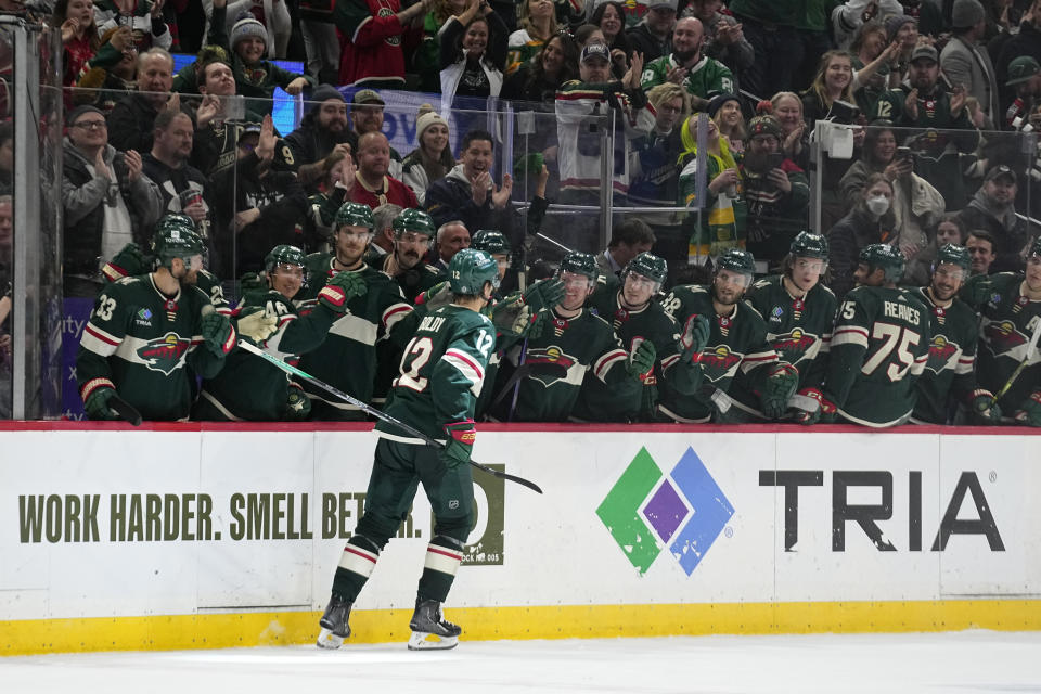 Minnesota Wild left wing Matt Boldy is congratulated after scoring a goal during the shootout in the team's NHL hockey game against the Dallas Stars, Friday, Feb. 17, 2023, in St. Paul, Minn. (AP Photo/Abbie Parr)