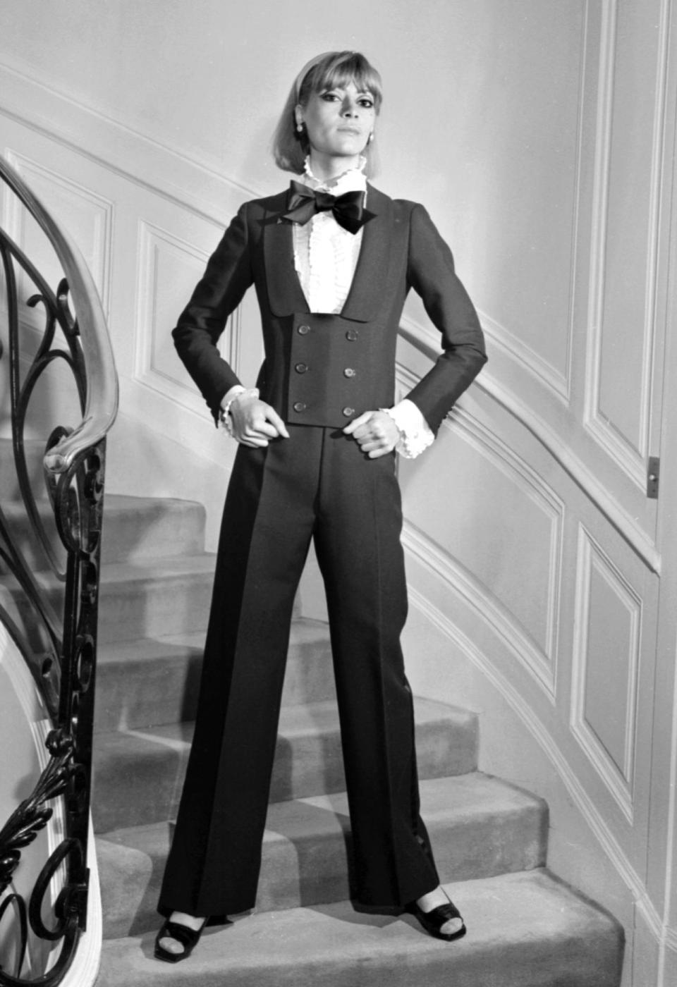 <p>A model wears an alpaca dinner jacket, jabot blouse, and black silk bow-tie at Yves Saint Laurent’s seminal Spring-Summer 1967 haute-couture collection. <i>Photo: Getty Images</i></p>