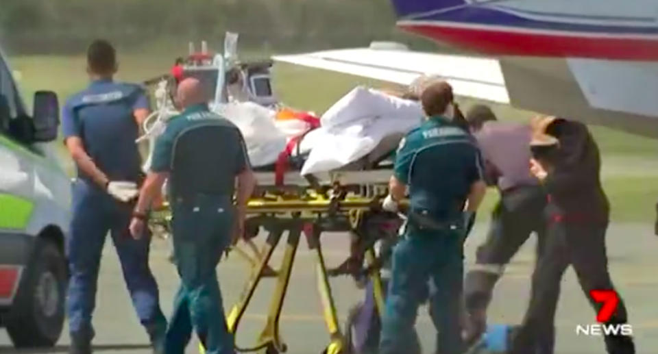 Hannah Papps is transported on a stretcher after the attack. Source: 7News