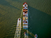 <p>Container ship and tugs. (© Jeffrey Milstein and courtesy Benrubi Gallery) </p>