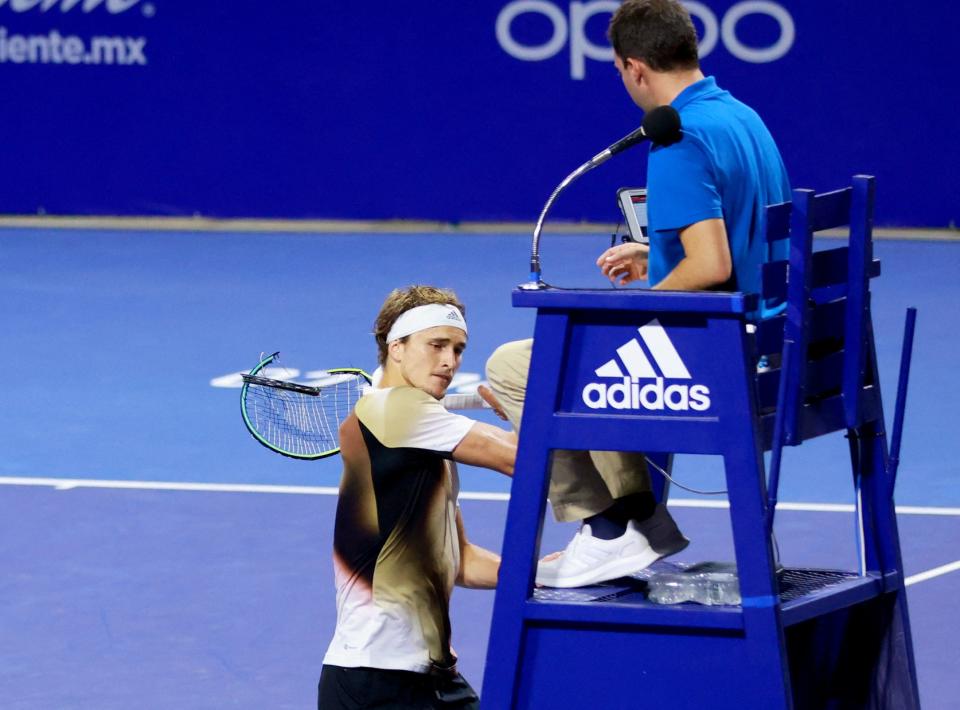 Germany's Alexander Zverev smashes his racket on the umpire's chair.