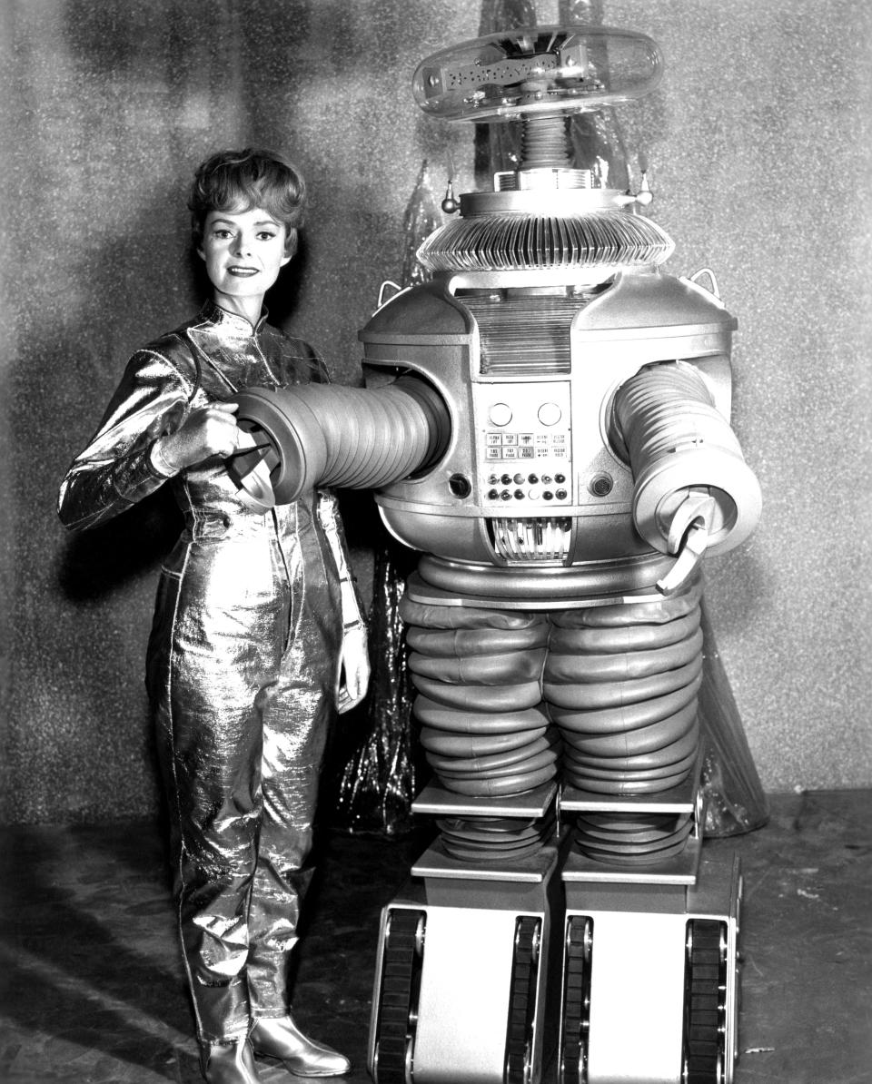 The robot in the 1965 version of<em> Lost in Space</em>, with series star June Lockhart. (Photo: Everett Collection)