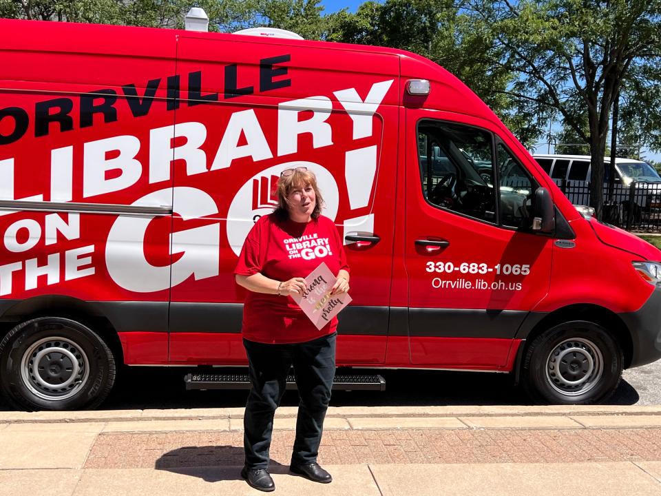 Orrville Public Library Director  Daphne Silchuk-Ashcraft talks about the Library on the Go program on Thursday when a kickoff ceremony was held.