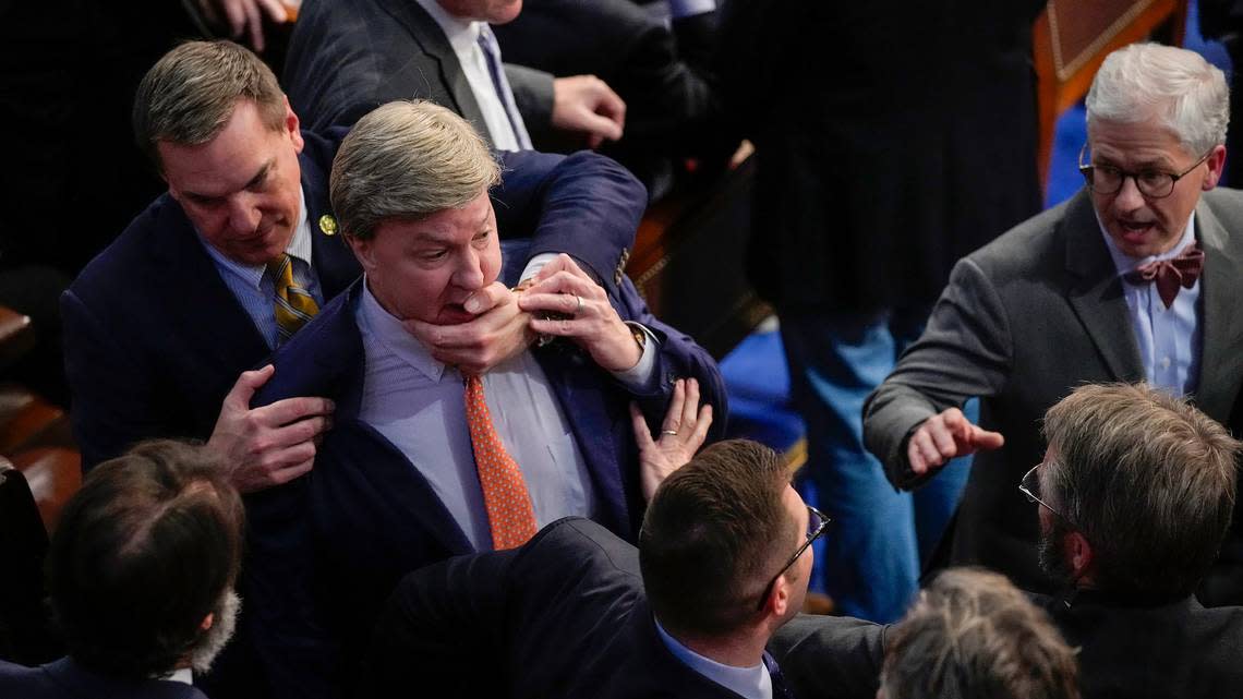 Rep. Richard Hudson, R-N.C., left, pulls Rep. Mike Rogers, R-Ala., back as they talk with Rep. Matt Gaetz, R-Fla., and other during the 14th round of voting for speaker as the House meets for the fourth day to try and elect a speaker and convene the 118th Congress in Washington, Friday, Jan. 6, 2023. At right is Rep. Patrick McHenry, R-N.C. (AP Photo/Andrew Harnik)