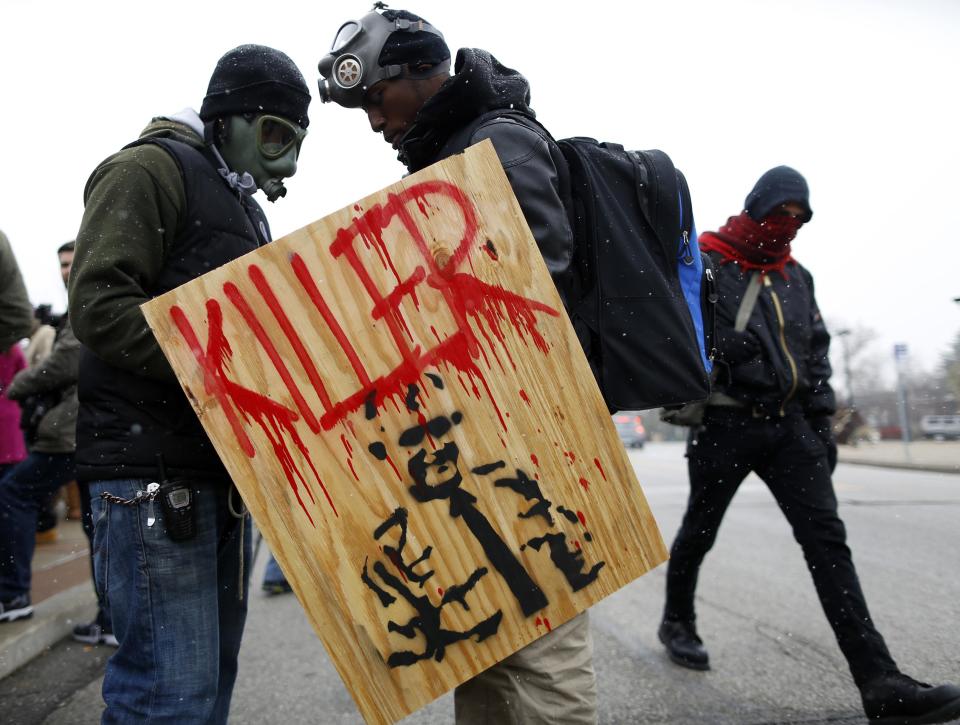 Demonstrators prepare to take part in a protest marking the 100th day since the shooting death of Michael Brown in St. Louis