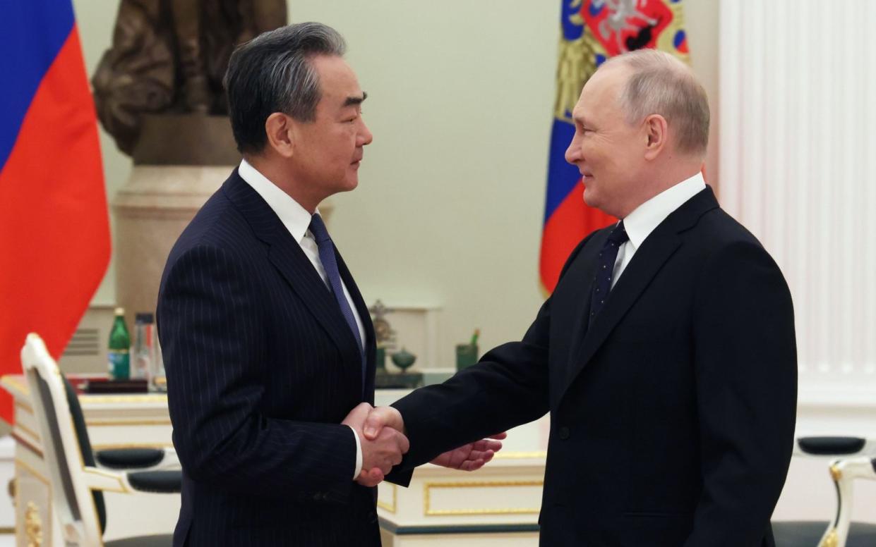 Wang Yi China Russia Vladimir Putin weapons invasion Ukraine war one year on - Anton Novoderezhkin/Sputnik/Kremlin/Pool/EPA-EFE/Shutterstock 