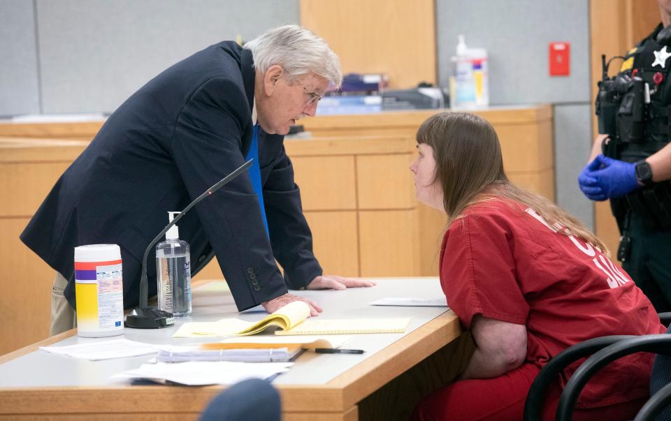 Alexandria Pauline Weinrich talks with her attorney, Ted Stokes, during a break in her trial on May 5, 2023. Weinrich was on trial for aggravated child abuse and was found Weinrich not guilty by reason of insanity.