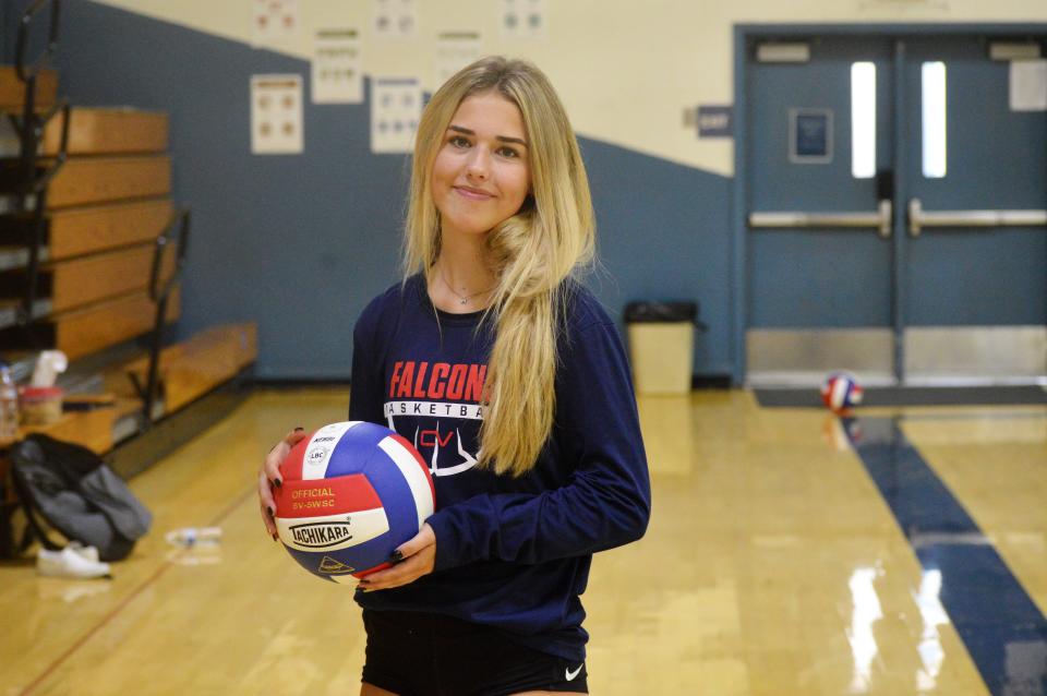 Central Valley High School senior libero Madison Whitehouse poses with a volleyball before practice on Monday, Aug. 9, 2021.