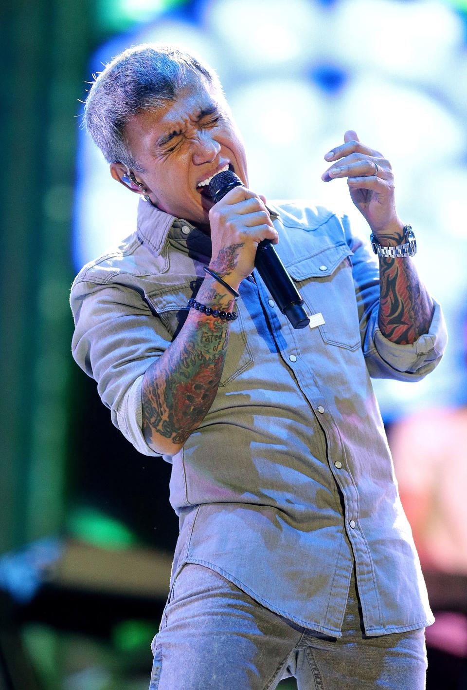 Arnel Pineda, lead singer for Journey, performs last year at Tom Benson Hall of Fame Stadium during the Concert for Legends.